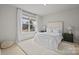 Bright bedroom with a plush white rug and a large window at 5024 Hillshire Ln, Mint Hill, NC 28227