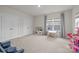 Bedroom with carpet floors, large windows and two closets at 5024 Hillshire Ln, Mint Hill, NC 28227