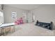 A bedroom for children with carpet floors and two large windows at 5024 Hillshire Ln, Mint Hill, NC 28227