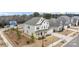 Aerial view of home showcasing its charming exterior, manicured landscaping, and inviting front porch at 5024 Hillshire Ln, Mint Hill, NC 28227
