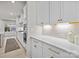 Elegant kitchen with white cabinetry, quartz countertops, and stainless steel appliances at 5024 Hillshire Ln, Mint Hill, NC 28227