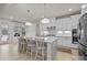 Stylish kitchen with island seating, stainless steel appliances, and contemporary pendant lights at 5024 Hillshire Ln, Mint Hill, NC 28227