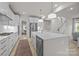 Open-concept kitchen with a large island, stainless steel appliances, and hardwood floors at 5024 Hillshire Ln, Mint Hill, NC 28227