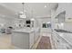 Bright kitchen featuring a large island, stainless steel appliances, and an open layout at 5024 Hillshire Ln, Mint Hill, NC 28227