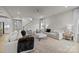 Open-concept living area featuring neutral tones, ample natural light, and a stylish rug at 5024 Hillshire Ln, Mint Hill, NC 28227