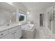 This main bathroom features double sinks, a soaking tub, and a separate shower at 5024 Hillshire Ln, Mint Hill, NC 28227
