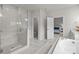 The main bathroom features a glass enclosed shower and a soaking tub at 5024 Hillshire Ln, Mint Hill, NC 28227
