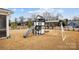 A backyard playset with a slide and swingset, perfect for outdoor fun at 5024 Hillshire Ln, Mint Hill, NC 28227