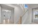 Bright staircase with wood and white painted trim and railing, leading to the upper level at 5024 Hillshire Ln, Mint Hill, NC 28227