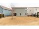 View of backyard featuring a grass lawn with iron fence and the back of the home at 515 Stickley Pl, Lancaster, SC 29720