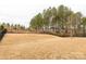 Large backyard with healthy grass, tall trees, and fence for added privacy at 515 Stickley Pl, Lancaster, SC 29720
