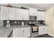Kitchen features granite countertops, and stainless steel appliances at 515 Stickley Pl, Lancaster, SC 29720