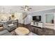 Inviting open-concept living area with a ceiling fan, hardwood floors, and easy access to the kitchen and stairs at 515 Stickley Pl, Lancaster, SC 29720