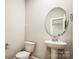 Powder room with pedestal sink and toilet at 5422 Army Rd, Marshville, NC 28103