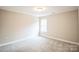 Bright bedroom featuring neutral walls and carpet at 5422 Army Rd, Marshville, NC 28103