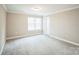 Bedroom with carpet, neutral walls, and window at 5422 Army Rd, Marshville, NC 28103
