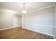 Bright dining room with hardwood floors and wainscoting at 5422 Army Rd, Marshville, NC 28103