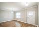 Bright dining room with hardwood floors and wainscoting at 5422 Army Rd, Marshville, NC 28103