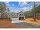 Two-story house with gray siding, white garage door, and a brick facade at 5422 Army Rd, Marshville, NC 28103