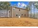 Rear view of two-story house with gray siding and multiple windows at 5422 Army Rd, Marshville, NC 28103