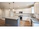 Modern kitchen with white cabinets, granite countertops, and a large island at 5422 Army Rd, Marshville, NC 28103