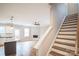 Open concept kitchen with granite island, hardwood floors, and staircase leading upstairs at 5422 Army Rd, Marshville, NC 28103