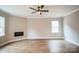 Light-filled living room with ceiling fan and hardwood floors at 5422 Army Rd, Marshville, NC 28103