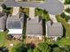 Aerial view of three homes with solar panels and fenced backyards at 6029 Landry Ln, Indian Land, SC 29707