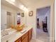Double vanity bathroom with a view into another bedroom at 6029 Landry Ln, Indian Land, SC 29707