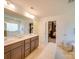 Double vanity bathroom with a view into the main bedroom at 6029 Landry Ln, Indian Land, SC 29707