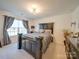 Bedroom with a dark-colored bed frame and neutral-colored bedding at 6029 Landry Ln, Indian Land, SC 29707