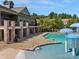 Community pool with clubhouse, deck, and mushroom water features at 6029 Landry Ln, Indian Land, SC 29707