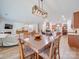 Casual dining area with wood table and chairs, open to the kitchen at 6029 Landry Ln, Indian Land, SC 29707