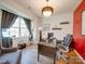Bright home office with built-in shelving and hardwood floors at 6029 Landry Ln, Indian Land, SC 29707