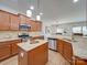 Modern kitchen with granite countertops, stainless steel appliances, and an island at 6029 Landry Ln, Indian Land, SC 29707