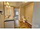 Bathroom with double vanity and wood-look floors at 6415 Sherwood Ln, Denver, NC 28037