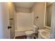 Clean bathroom, bathtub shower combo, and updated vanity at 6415 Sherwood Ln, Denver, NC 28037