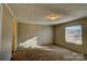 Bright bedroom with carpeted floors and large window at 6415 Sherwood Ln, Denver, NC 28037