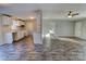 Open concept kitchen with white cabinets and wood-look floors at 6415 Sherwood Ln, Denver, NC 28037