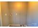 Simple laundry room with hookups for washer and dryer at 6415 Sherwood Ln, Denver, NC 28037