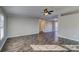 Spacious living room with gray walls and wood-look floors at 6415 Sherwood Ln, Denver, NC 28037