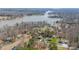 Picturesque aerial view of waterfront homes near a lake with private docks surrounded by mature trees at 6835 Ingleside Dr, Sherrills Ford, NC 28673