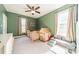 Spacious bedroom features carpeted floors, natural light, a modern ceiling fan, and a play area at 6835 Ingleside Dr, Sherrills Ford, NC 28673