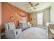 Charming Bedroom boasts a decorative wall, soft carpet, modern ceiling fan, and natural light at 6835 Ingleside Dr, Sherrills Ford, NC 28673