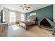 Bright bedroom with great natural light features a decorative wall, and a pet play area at 6835 Ingleside Dr, Sherrills Ford, NC 28673