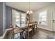 Light-filled dining area features hardwood floors, neutral walls, large windows and stylish furnishings at 6835 Ingleside Dr, Sherrills Ford, NC 28673