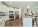 Bright kitchen features white cabinets, stainless steel appliances and a granite island, perfect for cooking and entertaining at 6835 Ingleside Dr, Sherrills Ford, NC 28673