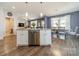 Spacious kitchen with island that includes dishwasher and dining area with views to the living room at 6835 Ingleside Dr, Sherrills Ford, NC 28673