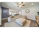 Open-concept living room showcasing hardwood floors, a large sectional couch, and seamless flow to the kitchen at 6835 Ingleside Dr, Sherrills Ford, NC 28673