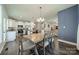Open-concept living space includes hardwood floors and features a kitchen, dining area and living room at 6835 Ingleside Dr, Sherrills Ford, NC 28673